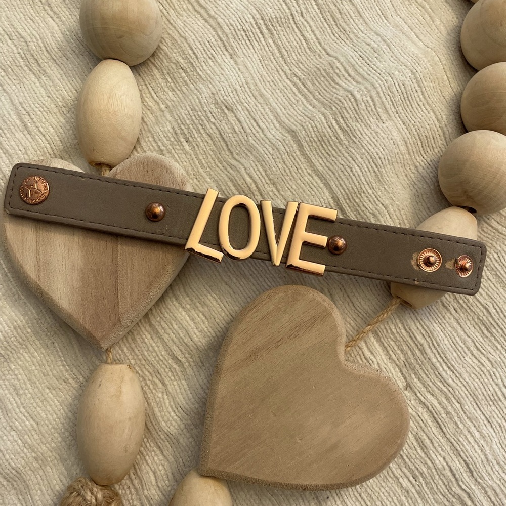 Light grey band, rose gold letters. Fabulous snap bracelet